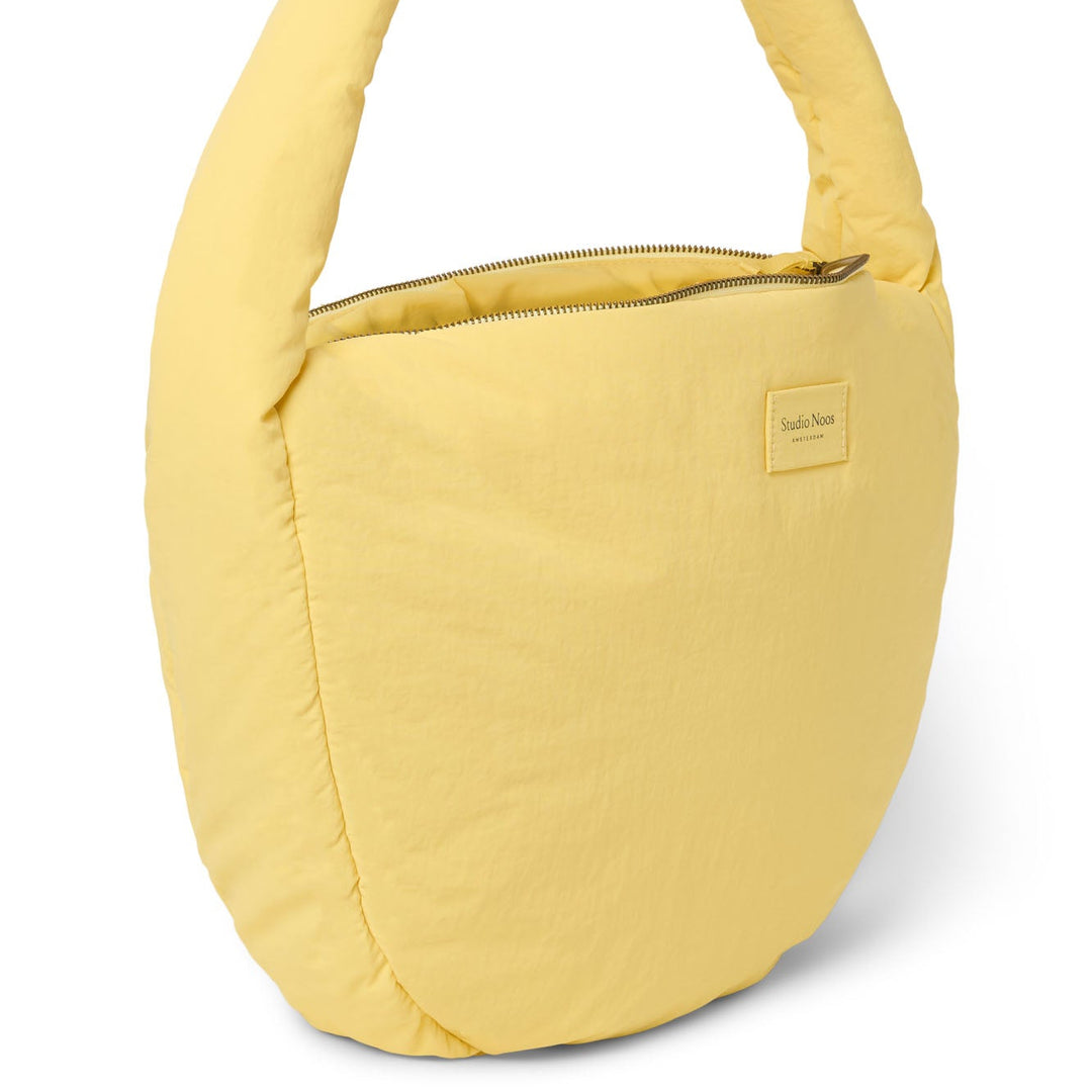 Puffy cross body bag botergeel