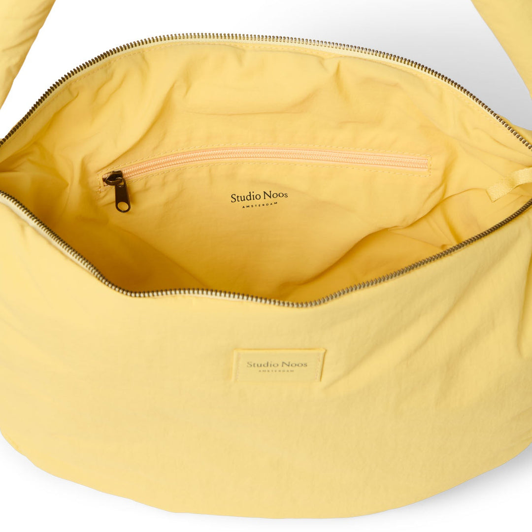 Puffy cross body bag botergeel
